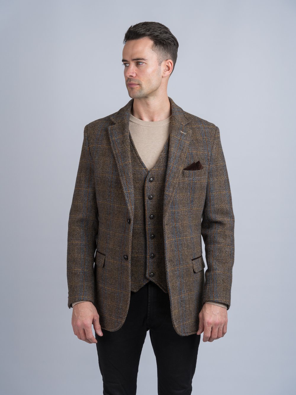 Veste de chasse en tweed marron avec bordure en moleskine