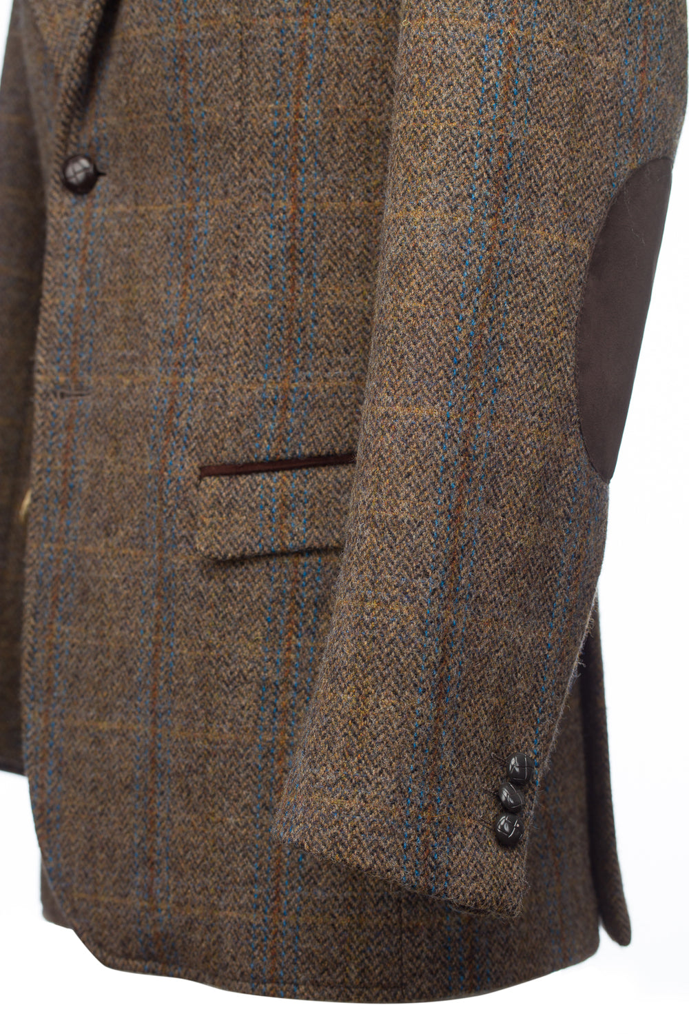 Veste de chasse en tweed marron avec bordure en moleskine